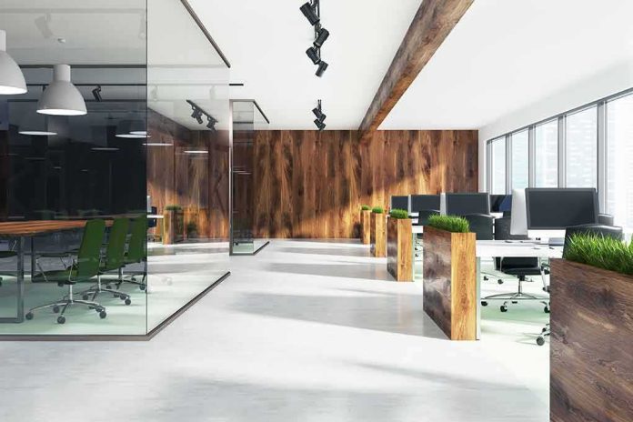 Modern open-plan office with wood accents and glass meeting room