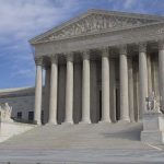High Court Says Presidents Can’t Rewrite The Supreme Court building featuring large columns and statues