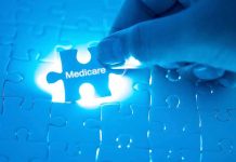 Hand placing a puzzle piece labeled Medicare
