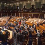 Alaska Stunner: Senator Picks Democrat Legislative chamber with members gathering on the floor