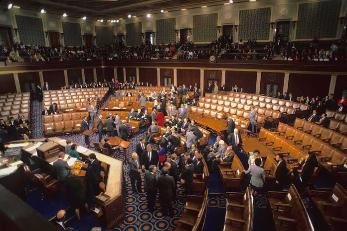 Legislative chamber with members gathering on the floor