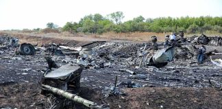 Nigerian Military Plane Crashes, Killing 32 Airplane crash debris scattered across a burned field