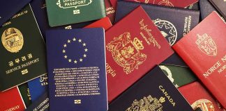 Assorted international passports spread out on a surface