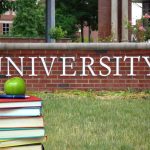 75% of U.S. Scientists Consider Leaving Stack of books with apple in front of university sign
