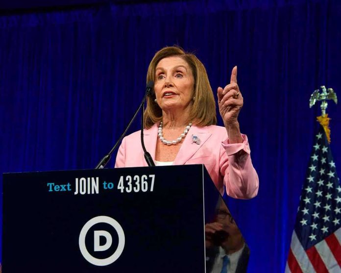 woman in pink blazer speaking at a podium