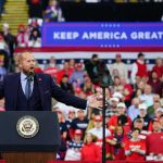 Trump Rallies Tennessee Republicans Crowd at a political rally with a speaker at a podium; Stephen Paea, Curtis Lofton, Walter Jones, John Sullivan, and Colin David Jones present