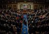 Legislative chamber audience stands and applauds