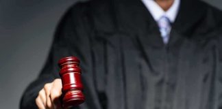 Senator Calls for Trump Aide Prosecutions Judge with gavel striking sound block