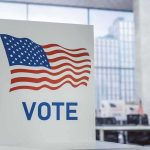 Stuns Both Parties: Battleground Senate Races Tighten Voting booth with American flag design in a modern polling place