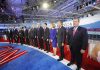 Chris Christie stands at right as Carly Fiorina, Jeb Bush, Ben Carson, and John Kasich line up on a debate stage