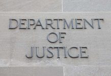 Department of Justice inscription on stone wall