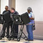 D.C. Election Records Exposed Lester Bowie and Miriam Tlali using electronic voting machines at a polling place