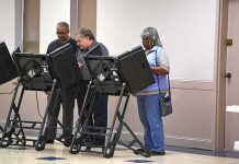 Lester Bowie and Miriam Tlali using electronic voting machines at a polling place