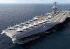 Aircraft carrier at sea with fighter jets on deck