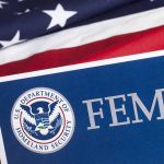 FEMA logo with American flag background.