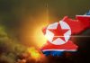 North Korea map with flag over rocket launch background