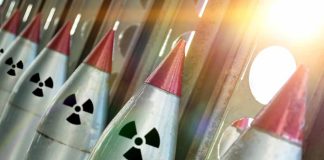 Line of nuclear missiles with radiation hazard signs