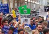 Pro-life rally with people holding various signs