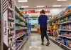 Person shopping in a CVS pharmacy aisle