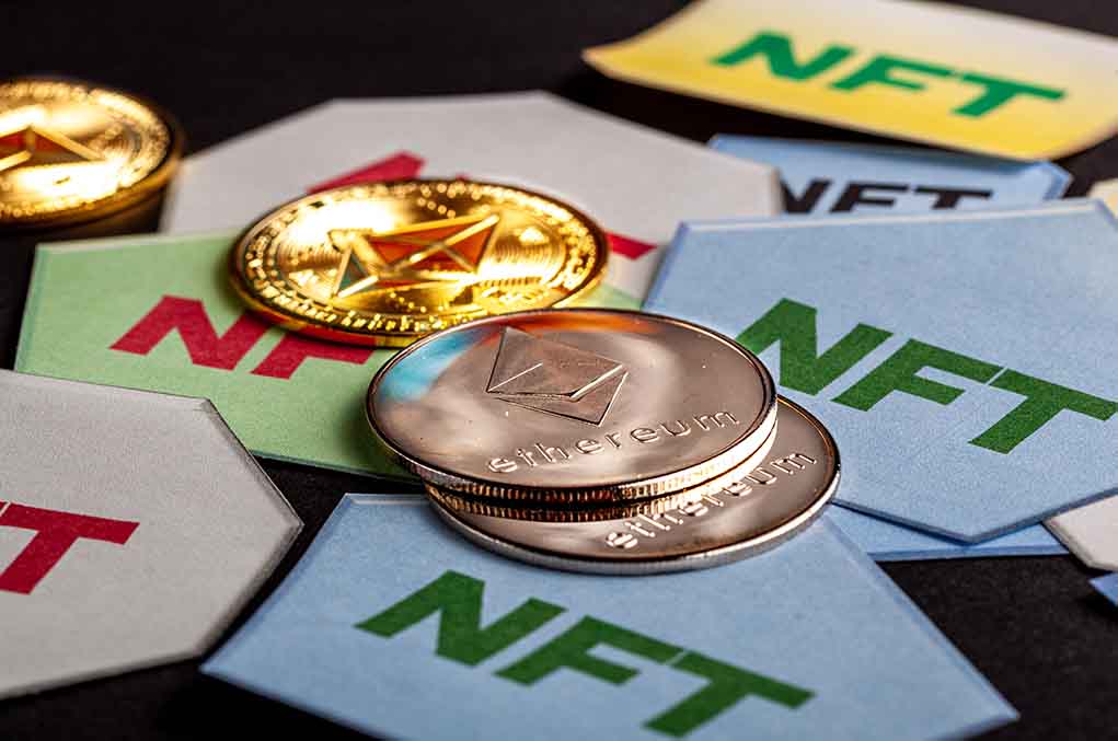 Ethereum coins on NFT cards background
