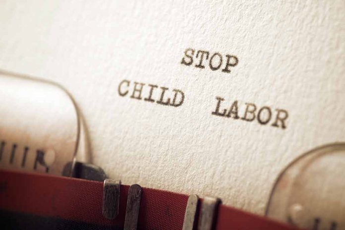 2074595140 featured image Typewriter message says stop child labor