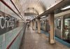 Chicago subway station platform with parked train.