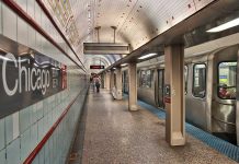 Chicago subway station platform with parked train.