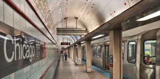 Chicago subway station platform with parked train.