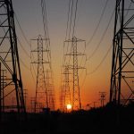 Transmission towers at sunset