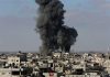 Large explosion over a crowded urban area