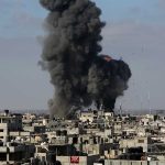 Large explosion over a crowded urban area