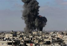 Large explosion over a crowded urban area