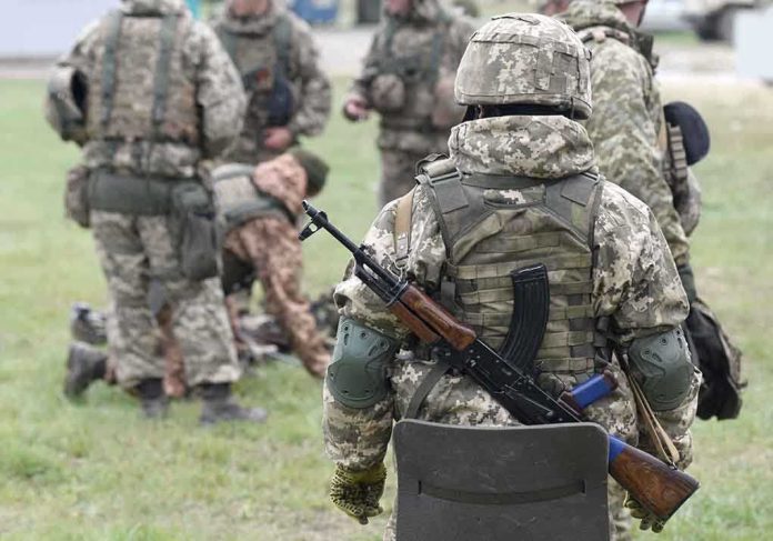2057061182 featured image Soldiers in camouflage gear gathered on grass field