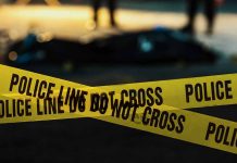 Police tape marking a crime scene at night