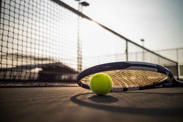 545014621 featured image Tennis racket and ball on court near net