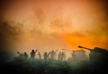 Soldiers and tanks in the foggy battlefield