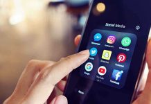 Finger tapping smartphone social media app icons