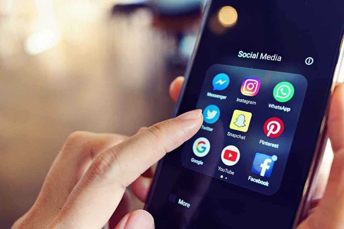 1064490605 featured image Finger tapping smartphone social media app icons