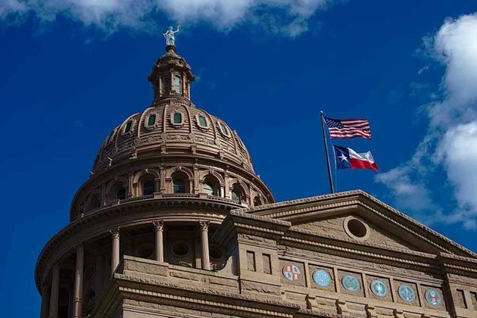 1673539927 Building dome with US and Texas flags, blue sky.