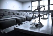 Scales of justice in an empty courtroom