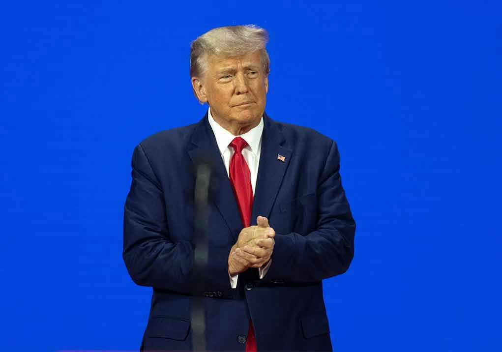 Man in a suit with a blue background