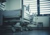 Empty hospital beds by a window