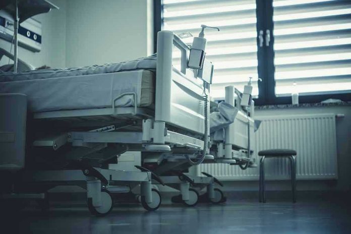 2292007351 Empty hospital beds by a window