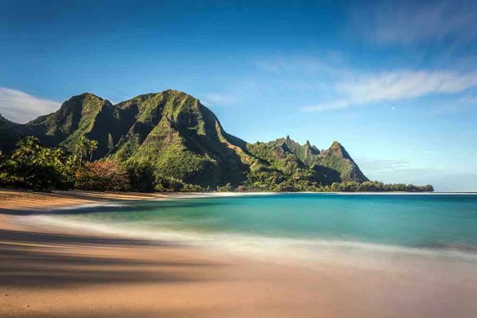 268481546 Beach with mountains and clear blue water
