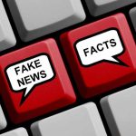 Keyboard keys labeled "Fake News" and "Facts."