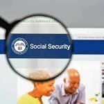 Magnifying glass focusing on Social Security Administration webpage