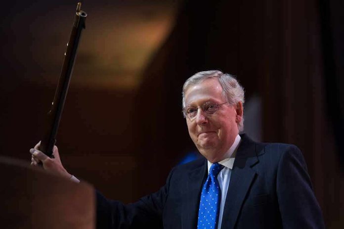 A man in a suit holding a gavel at a podium