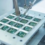 Close up of a soldering machine working on circuit boards