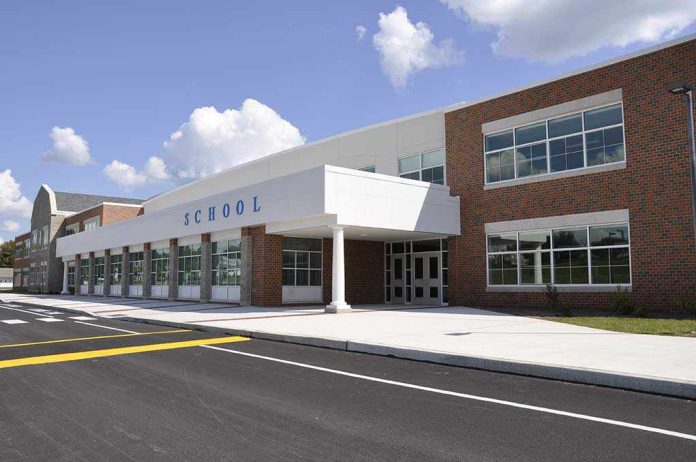 shutterstock_37352986.jpg Modern school building with large windows and a clear sky