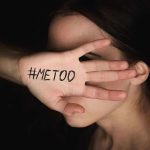 Hand with "#MeToo" covering face.